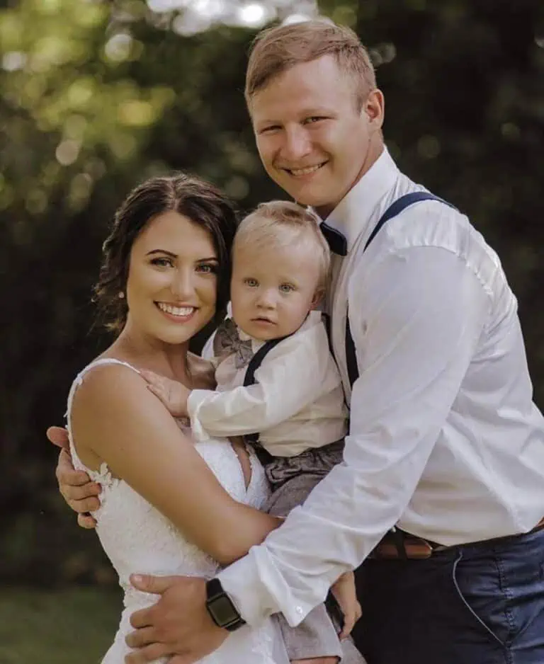 Ashley Herron family photo with her husband and child.