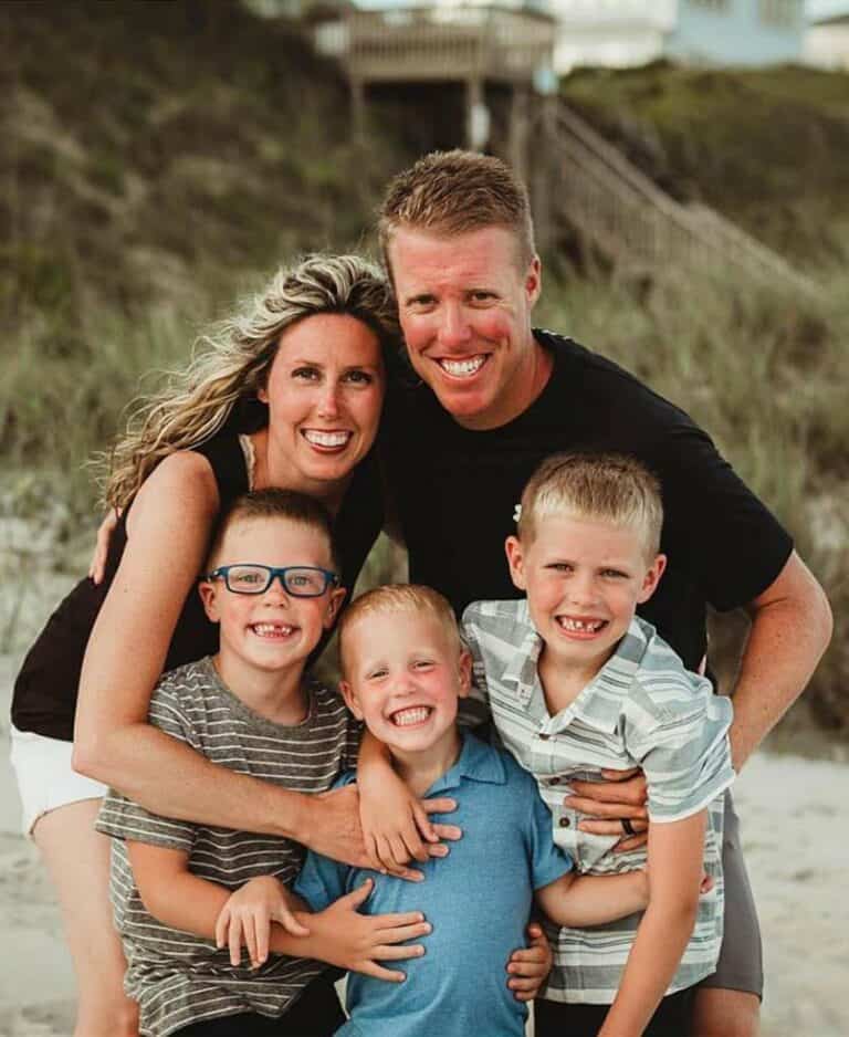 Scotty Jones realtor with wife and three sons on a beach.